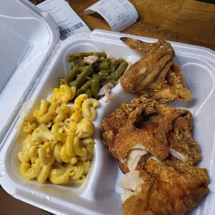 Fried chicken breast, a wing, mac-n-cheese and delicious green beans