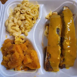 2 meaty ribs with gold sauce, a good choice, yams, and mac-n-cheese