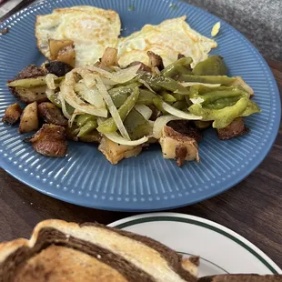 Amazing eggs and home fries.