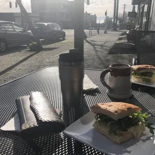 a sandwich and coffee on a table