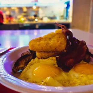 fried eggs and bacon on a plate