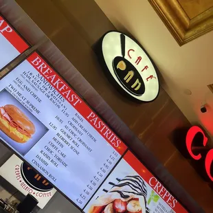 a menu and a clock on the wall