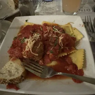 Mushroom stuffed ravioli with tomato sauce and it had chunks of soft tomatoes in it.