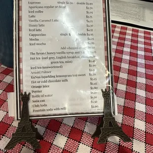 Cute Eiffel Towers holding drink menu