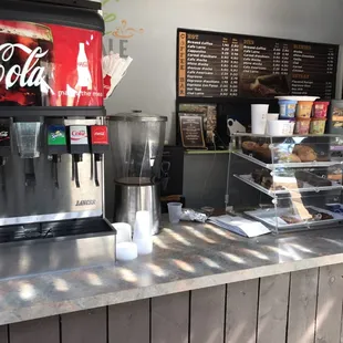 a coca cola machine on the counter