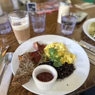 Eggs, black beans, Gluten Free seeded bread, jam