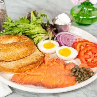 Cold smoked salmon with your choice of bagel, greens, tomato, onion, capers and a soft-boiled egg. Choose between cream cheese or hummus.