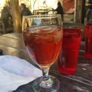 a glass of wine on a table