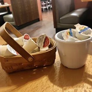 a basket of coffee and a cup of coffee