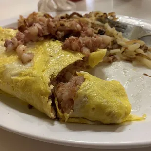 Corn Beef Hash omelette. Not on the menu but suggested by my server  so damn good!