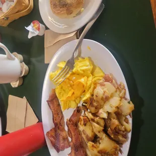 Eggs bacon, potatoes  and English muffin