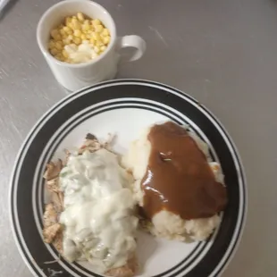 Smothered chicken with mash and gravy &amp; corn