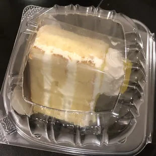 A $9.50+tax cake packed in a generic plastic box.