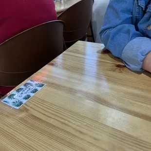 Those two inches between the back of her chair and our table is my only exit.