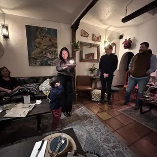 a group of people in a living room