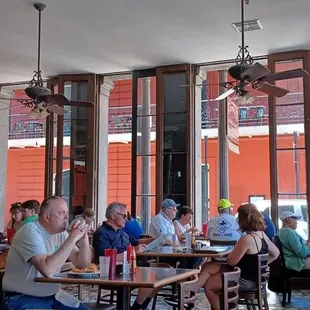 people sitting at tables in a restaurant