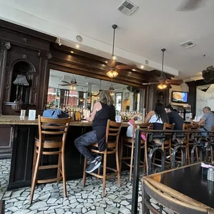 people sitting at the bar