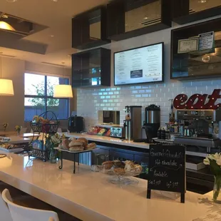 a bar with a counter and chairs