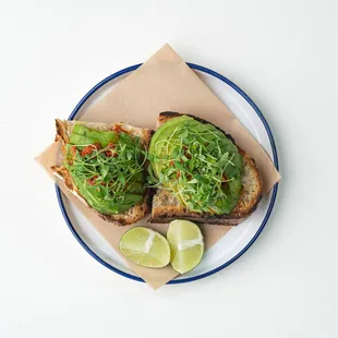 avocado toast with a slice of lime