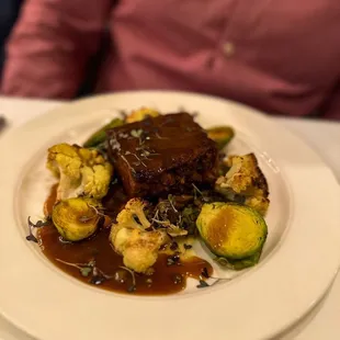 Gigot D'Agneau aux Lentillesslow cooked leg of lamb, french green lentil, roasted cauliflower, brussel sprout, thyme jus