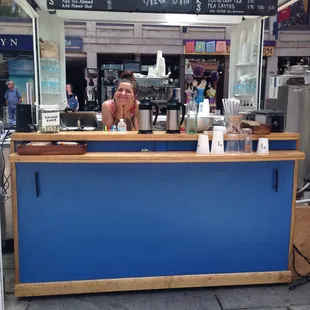 a woman behind the counter