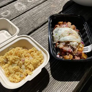 a plate of macaroni and cheese and a container of macaroni and cheese on a picnic table