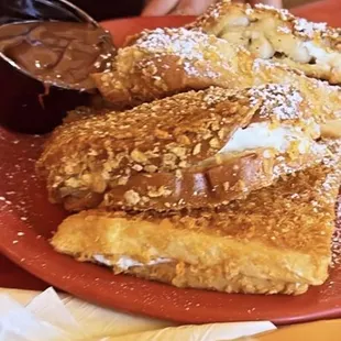 Stuffed Banana cream cheese and Nutella French toast frosted in cereal flakes!! 10/10
