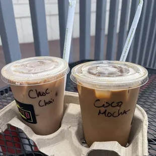 two cups of iced coffee on a table