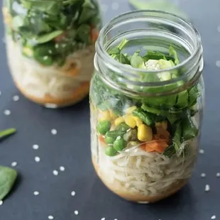 two mason jars filled with veggies
