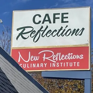 a sign for a new reflections culinary institute