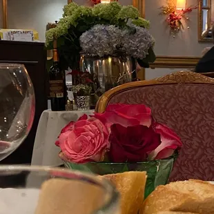 a glass of wine and a plate of bread
