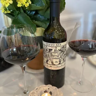 a bottle of wine and two glasses of wine