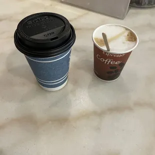 two cups of coffee on a counter
