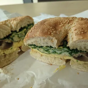 half of a sandwich with egg and spinach