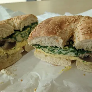 a sandwich cut in half on a piece of paper