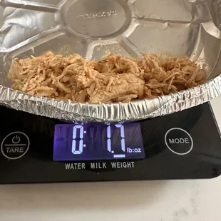 Tortilla less shredded chicken taco. A hefty portion of meat weighing in at 1.7 oz.    . No bueno!