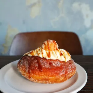 a donut with cream on top