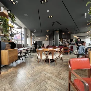 people sitting at tables in a restaurant