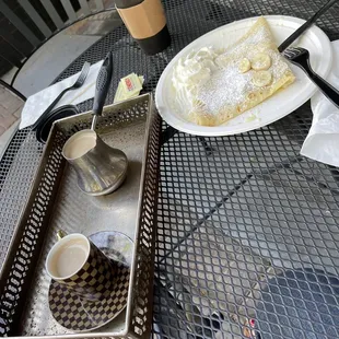 Lechera crepe with bananas and a Turkish coffee with milk.
