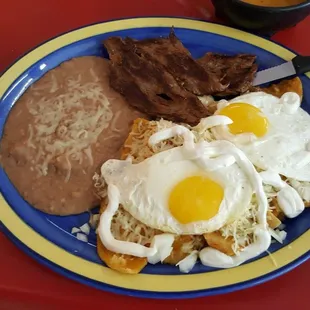 a plate of food on a red table