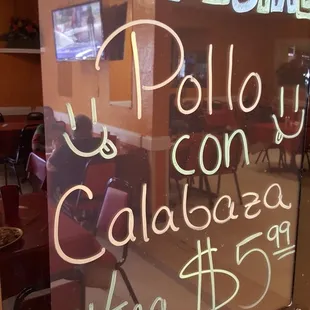 a sign in the window of a restaurant