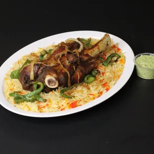 Indulge in the savory flavors of a tender and juicy seasoned lamb shank, perfectly paired with either a bed of fragrant basmati rice or our