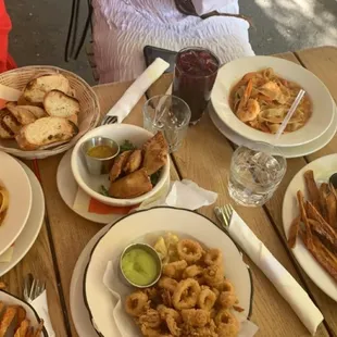 Shrimp Linguine, Calamari, Rue Dixe Burger, Veggie Fataya, and Spicy Poulet Sandwich