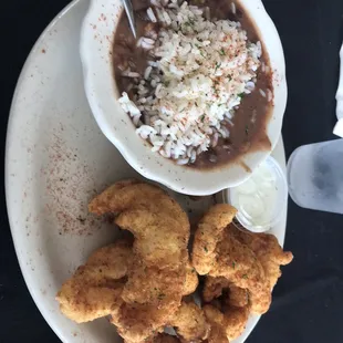 Catfish dinner with red beans and rice.