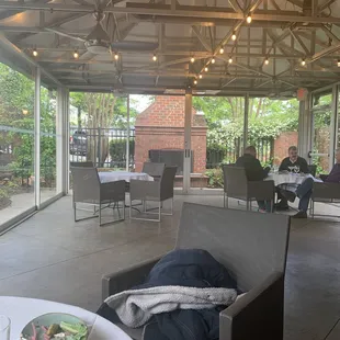 The view of the fireplace from the warm indoor patio.