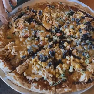 Barbecue chicken pizza with black beans and corn added on top