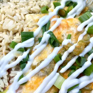 Chicken enchiladas with added green chiles, green onions, and sour cream.