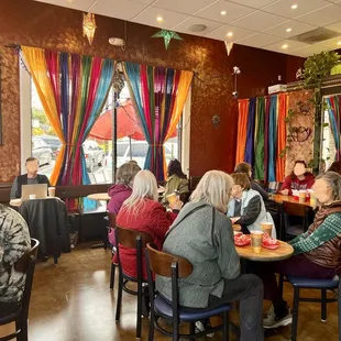 a group of people sitting at tables