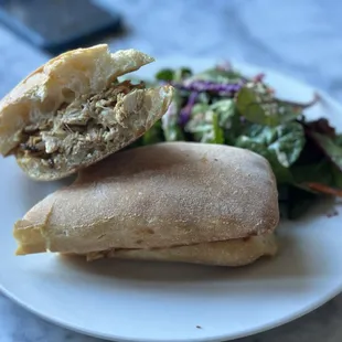 a sandwich and a salad on a plate