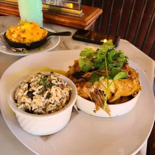 Curry chicken with rice and peas and mac and cheese
